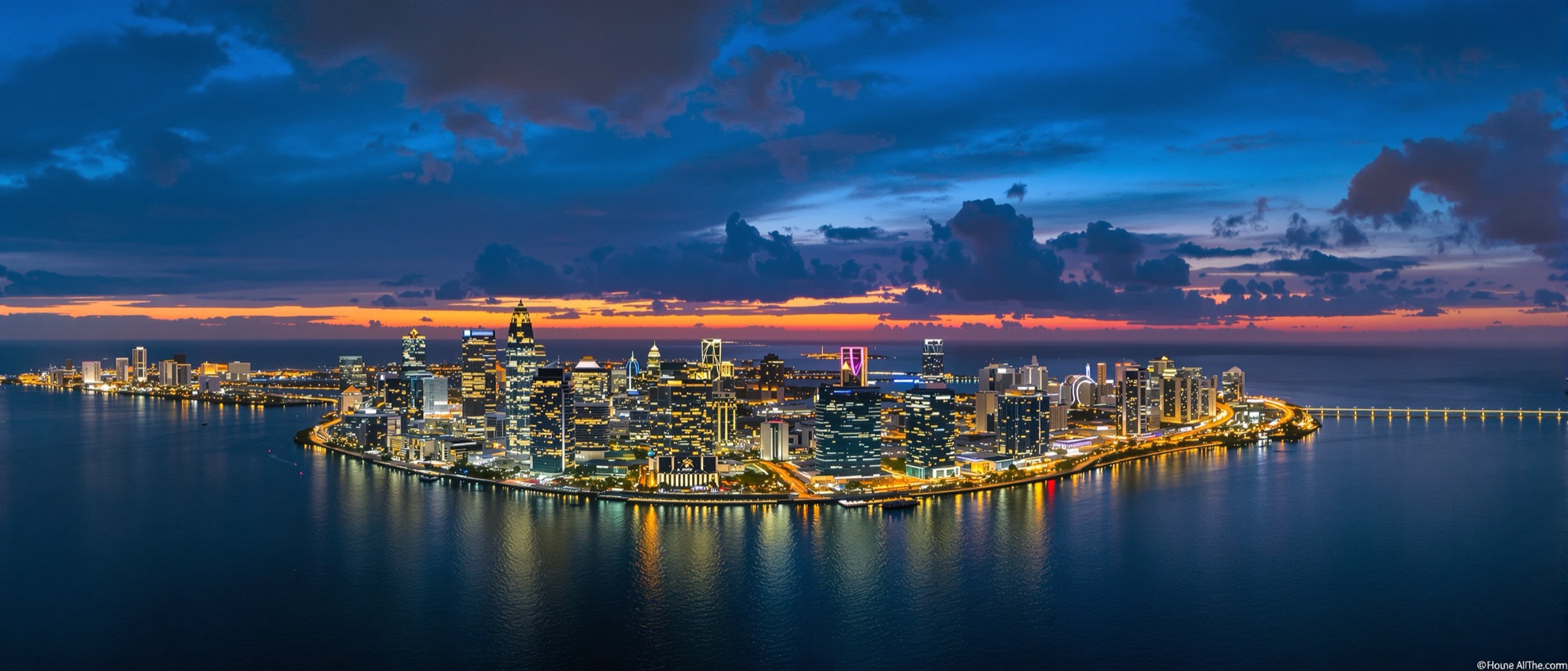 Ultra-wide aerial panorama of the Miami skyline at dusk over Biscayne Bay